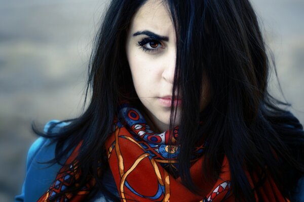 Black-browed brunette with a bright scarf