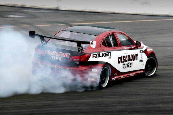 Drift of the red Lexus. smoke from the wheels