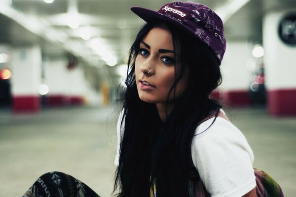 Brunette girl in a beautiful cap