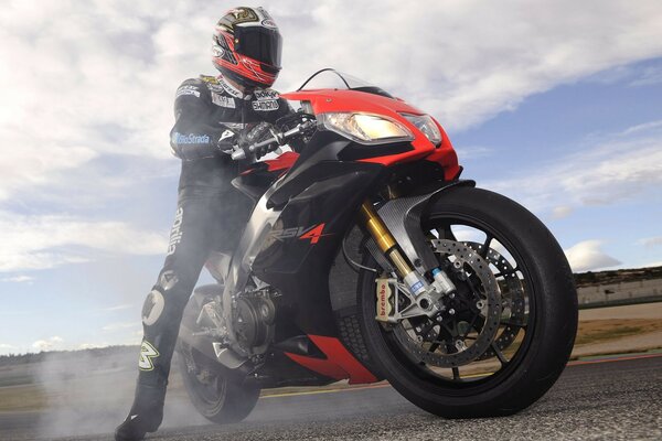 Biker on Aprilia makes a burnout