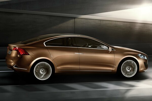 A brown Volvo in the garage