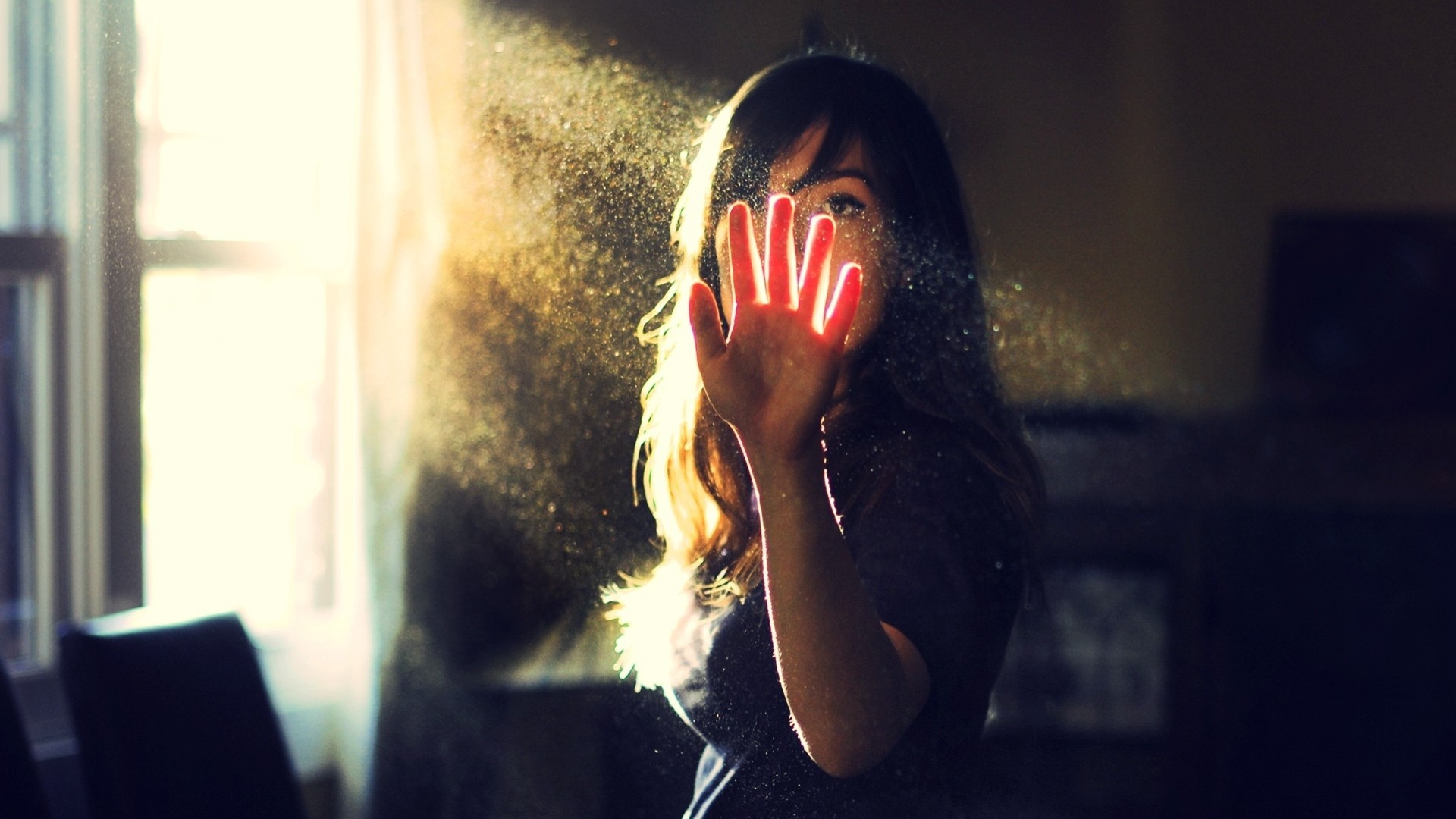 a woman hand girl brunette black light