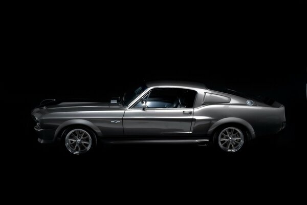 Silver ford mustang on a black background