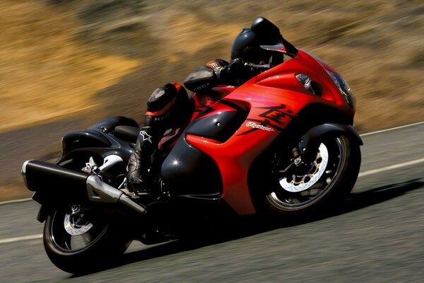 High-speed riding on a bright red motorcycle