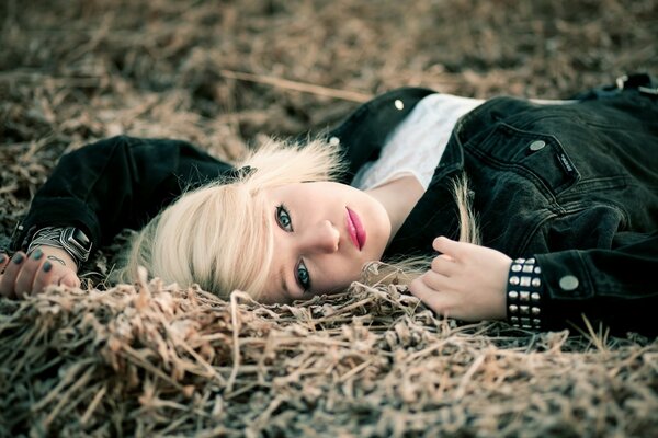 Blonde on the grass with a bright appearance