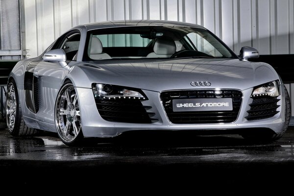 Grey car on display in the hangar