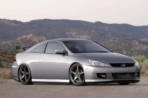 Honda sports car on the background of mountains