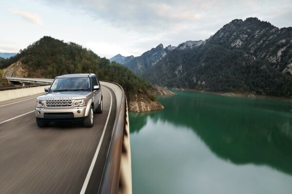 Promotional photo of an SUV car on the background of mountains