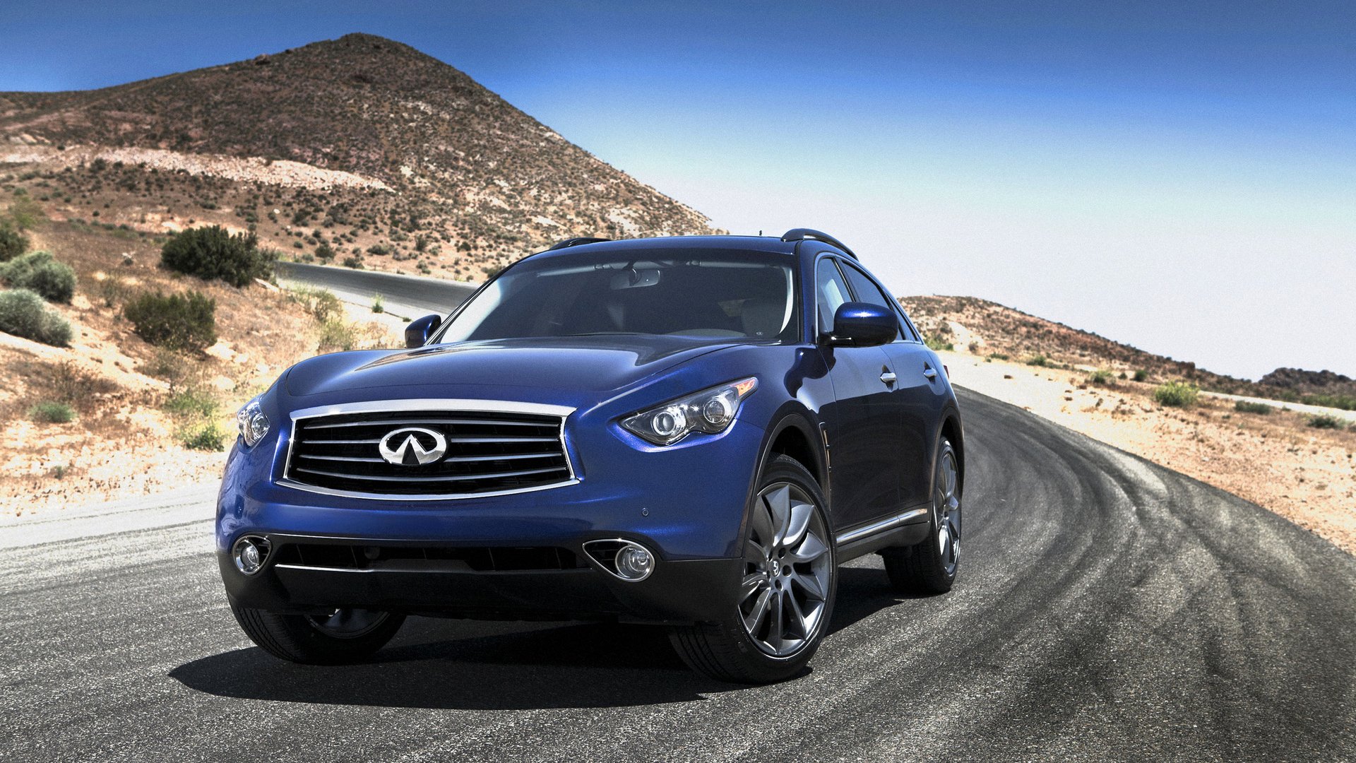 infiniti fx35 suv sport utility vehicle ruedas hatchback faros emblema paisaje montaña carretera