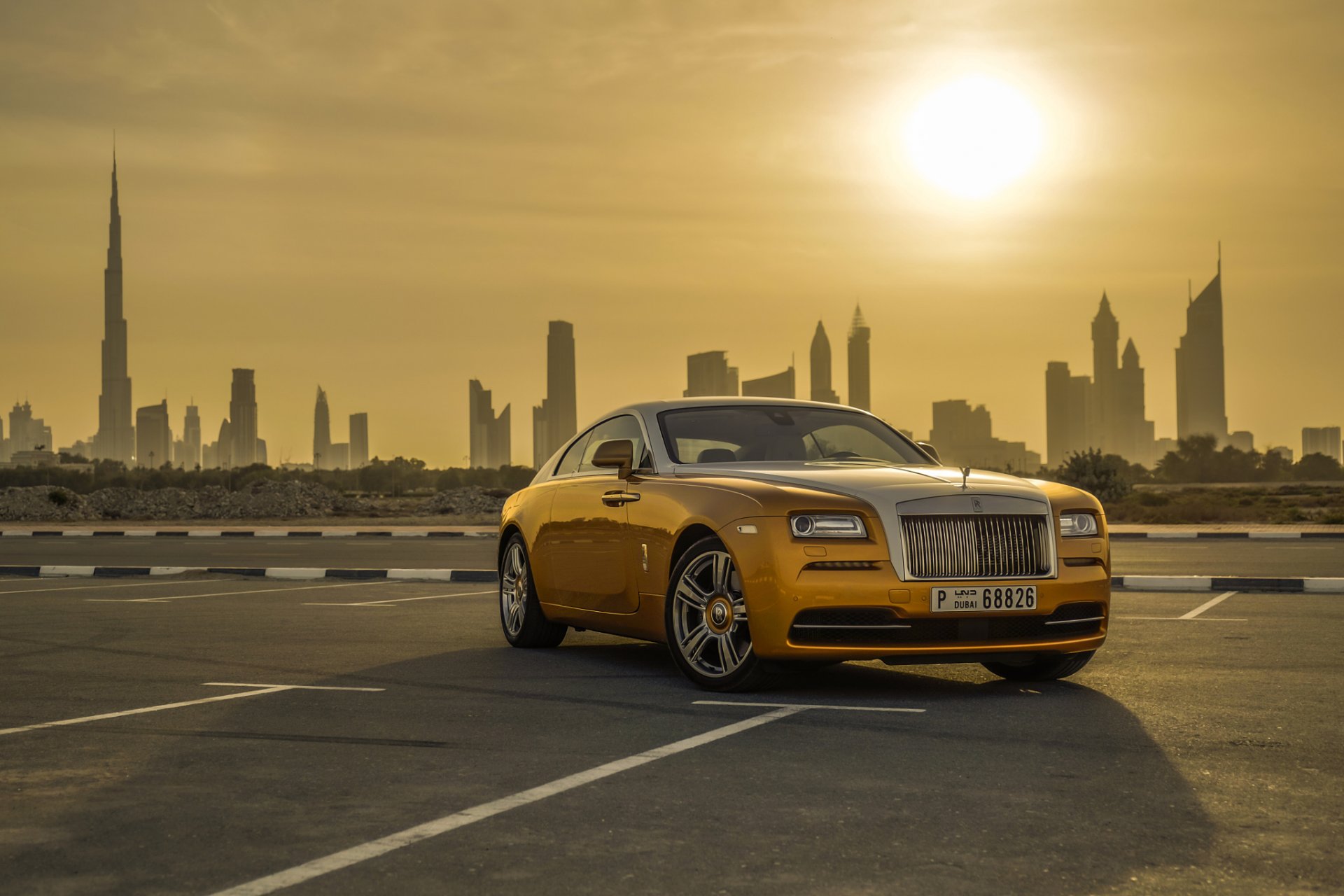 rolls-royce wraith luxury car gold dubai cityscape