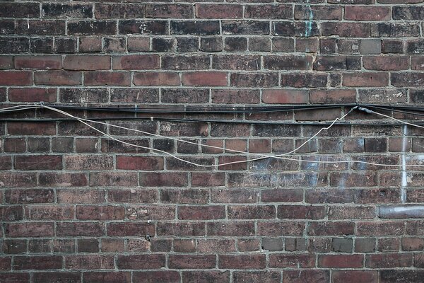 Old brick wall with wires