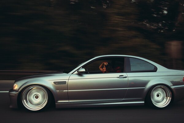 Gorgeous girl driving a gorgeous BMW car