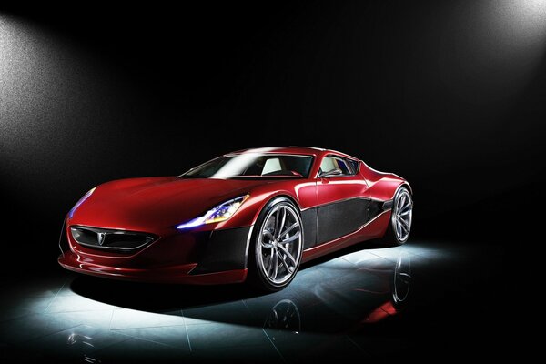 A red Rimak car in the dark