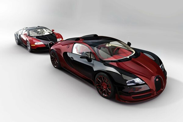 Два чёрно-красных спорткара Bugatti Veyron