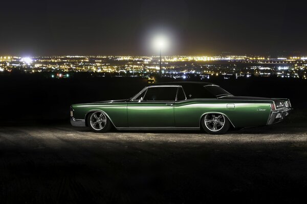 Lincoln continental car at night outside the city