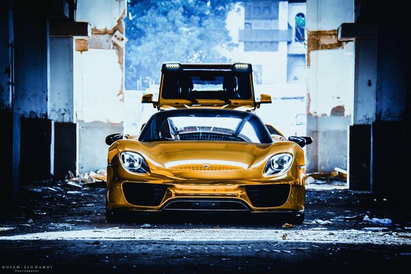 Golden Porsche Spider and golden Mercedes g class