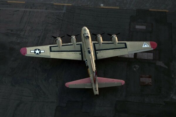 An American plane flies over the fields