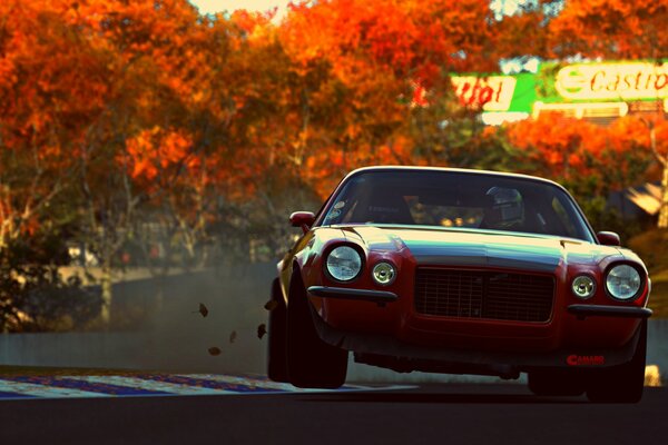 Coche deportivo con fondo de hojas rojas