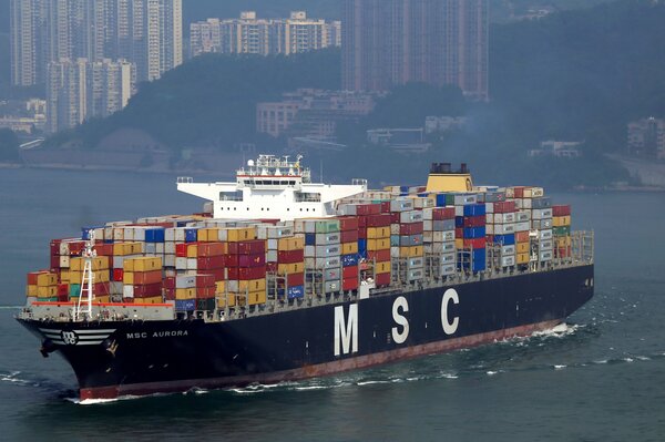 A large container ship is sailing on the sea