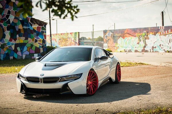 Tuned Electric car from BMW on the background of street art