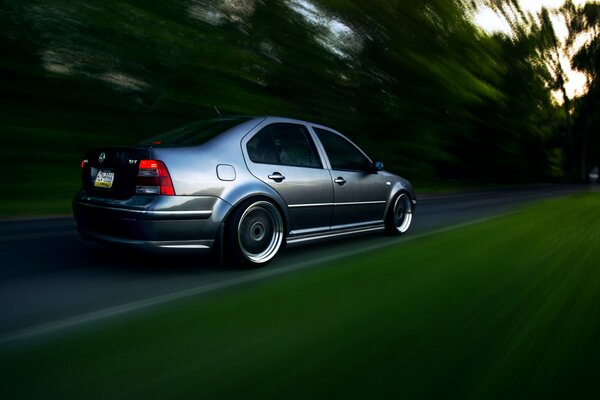 Grey tuned Volkswagen at speed