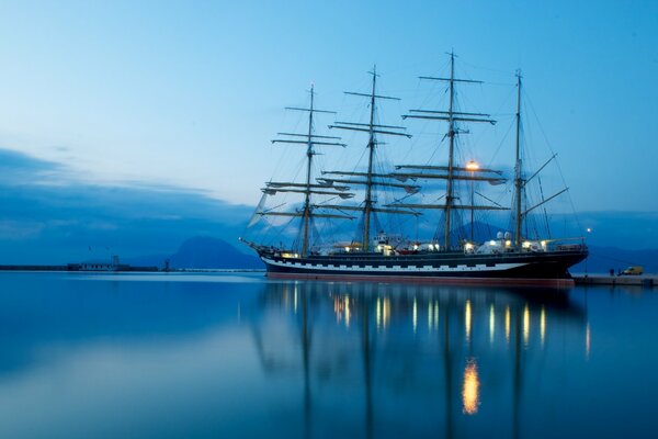 A beautiful ship is shown on a beautiful blue background