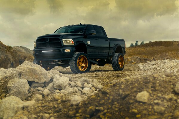 Bronze SUV in rocky terrain