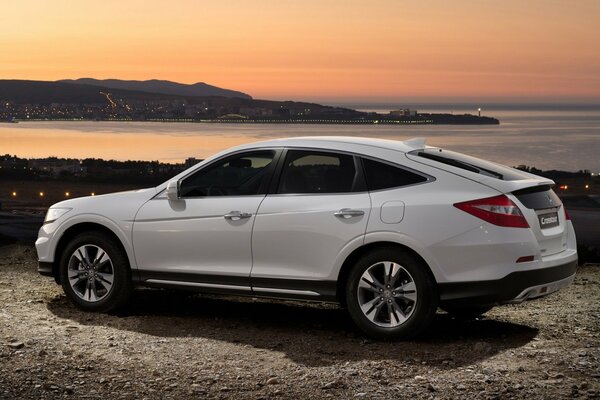 White Honda on the seashore