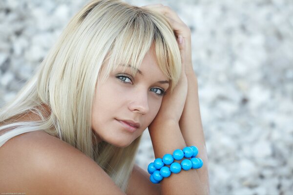 Delicate blonde with turquoise bracelet