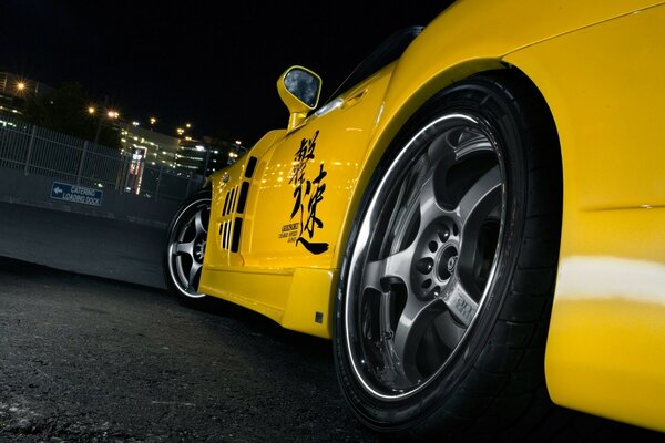 Cool bright yellow car at night