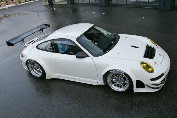 White porsche 911 gt3 rsr sports car on the street