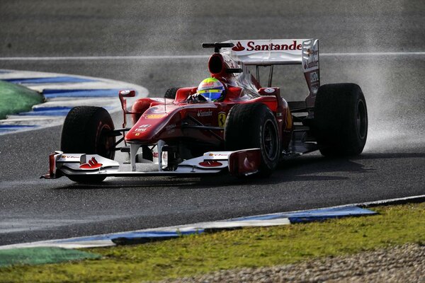 Ferrari F10 on the race track during a turn