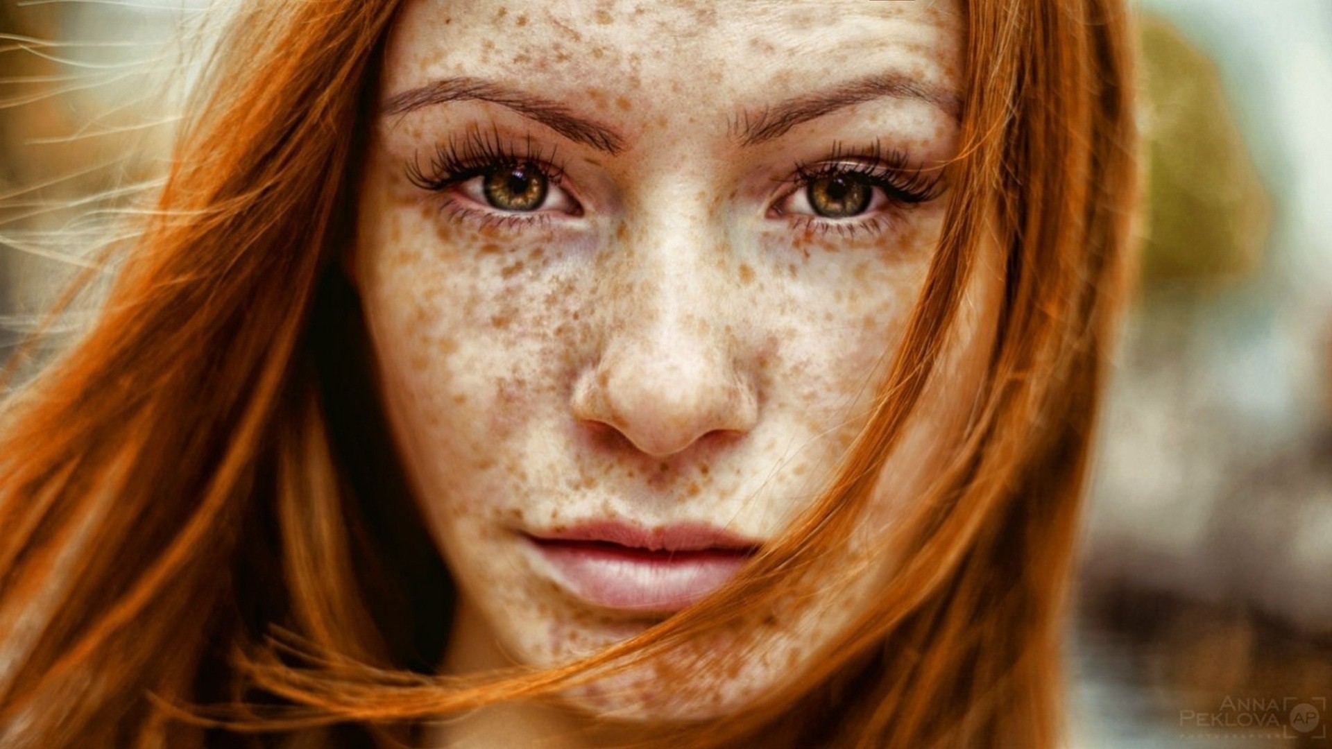 a woman girl red grey close up face