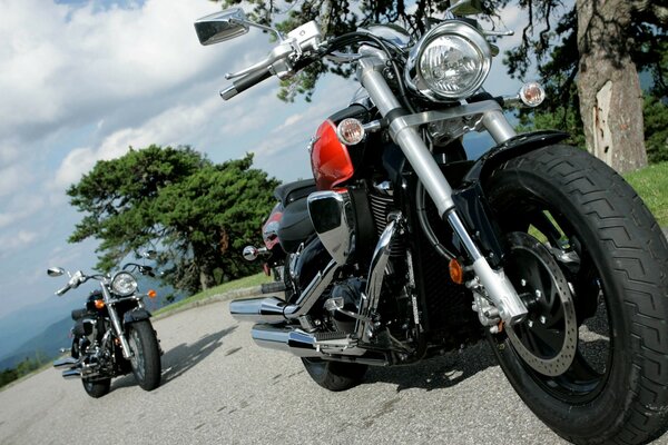 Two motorcycles standing on the road without motorcyclists