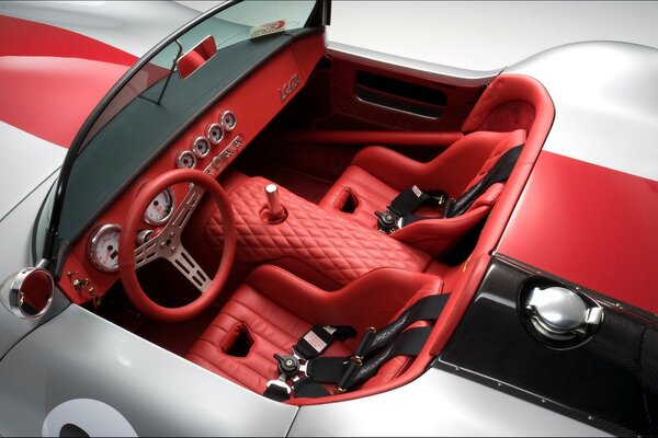 The interior of a popular car with a red interior