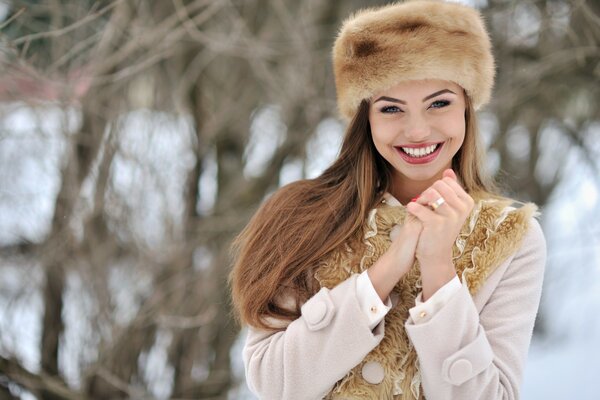 A girl in a winter outfit and a hat