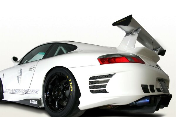 White Porsche with spoiler on light background