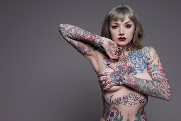 Girl with colored tattoos all over her body