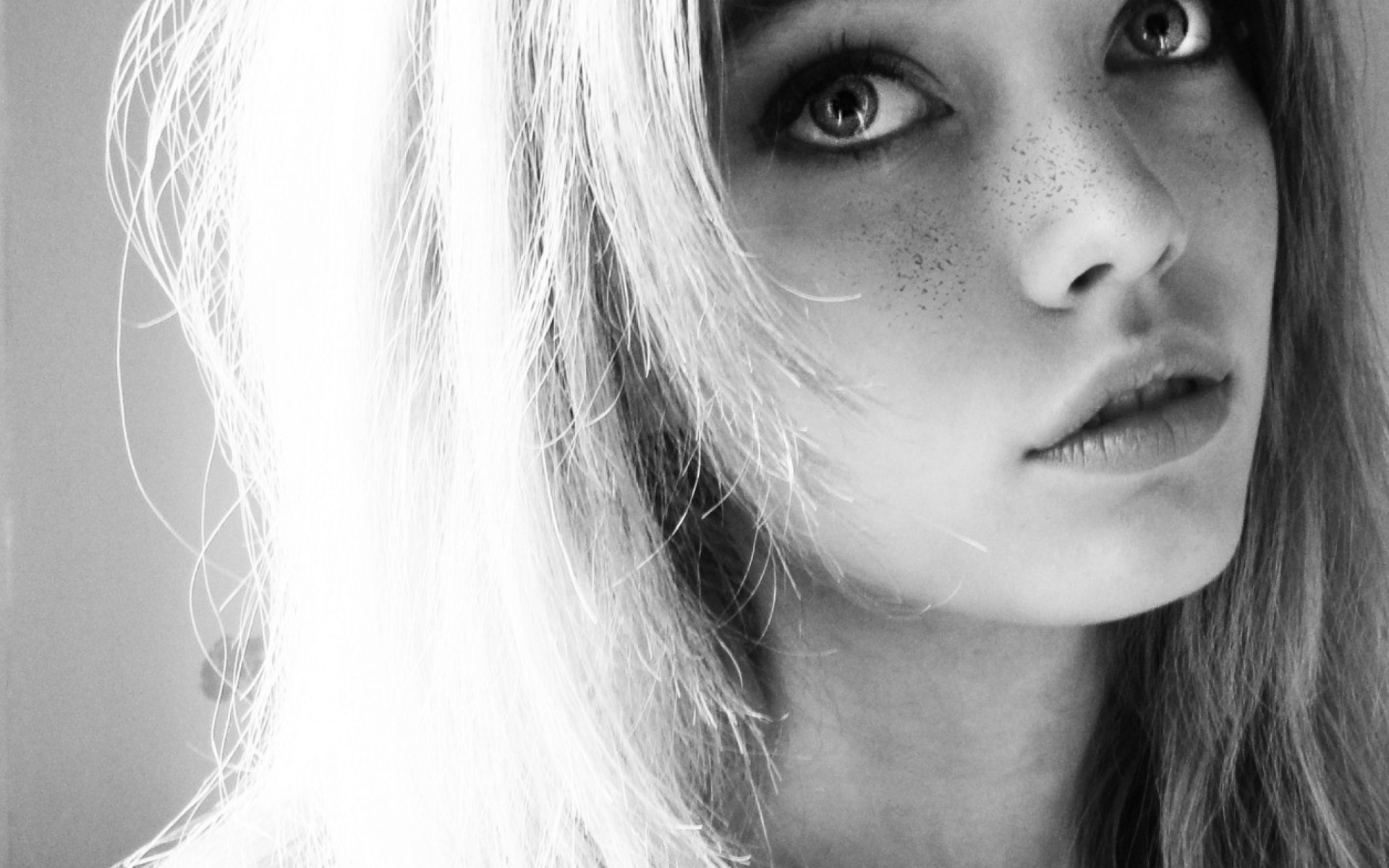 a woman girl blonde close up bw face