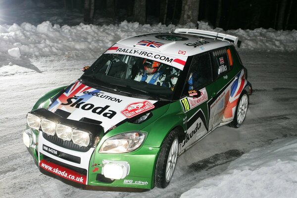 A car with inscriptions on a snowy road