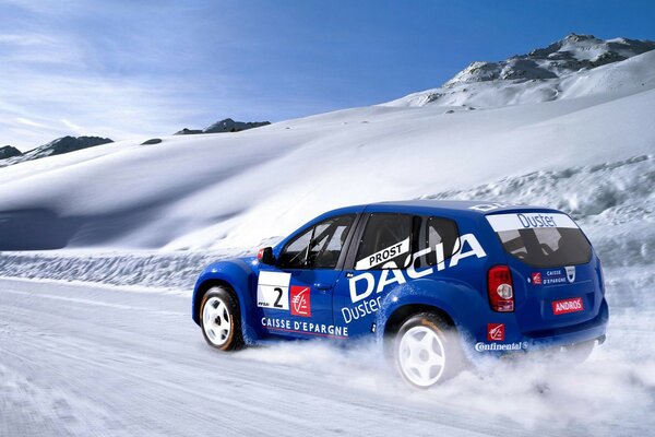 Blue duster car photo in winter with snow