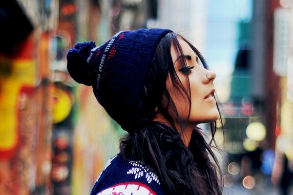 Profile of a girl in a knitted hat