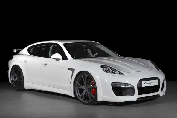 A chic white Porsche on a dark background