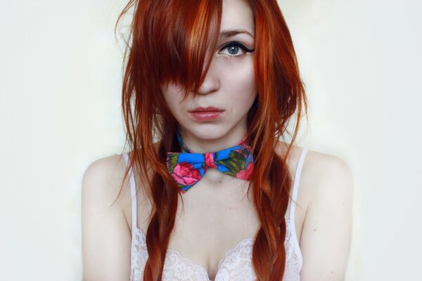 Red-haired girl with a bright butterfly