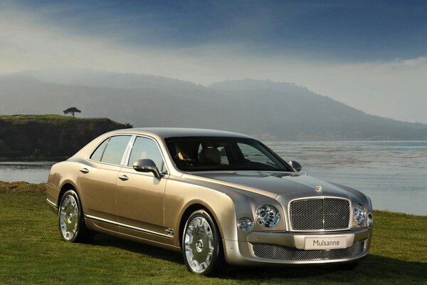 Landscape with beige bentley mulsanne by the water