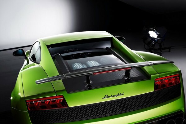 Green Lamborghini sports car in the parking lot