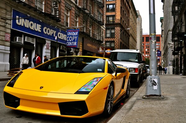 Lamborghini car in yellow on the city street