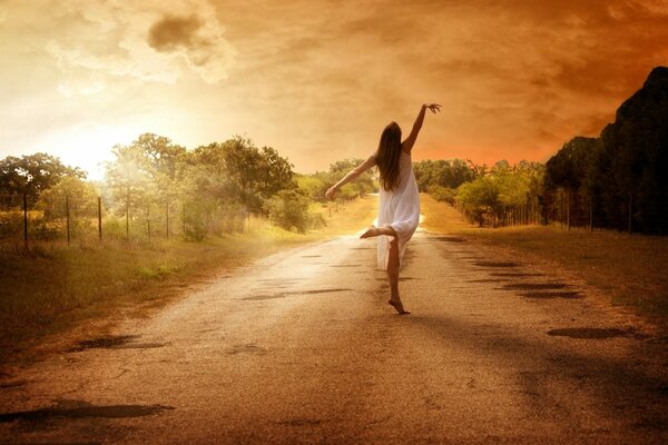 Girl on the road in a white dress