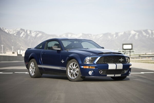 Sheby car on the highway near the mountains