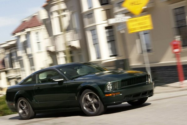 Dark Ford Mustang in the city